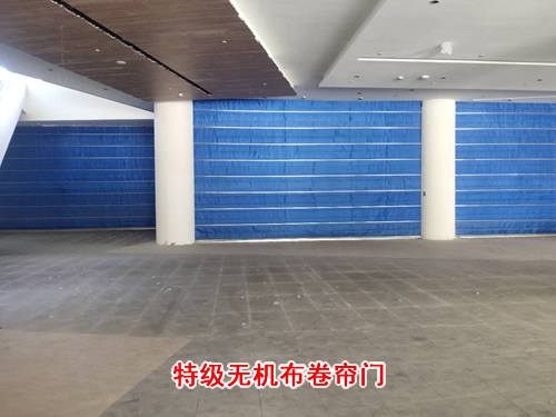 防火卷帘应选用电动装置还是手动装置？